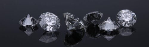 Loose diamonds on black background