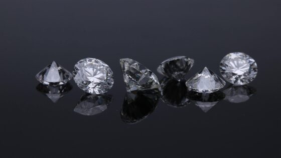 Loose diamonds on black background